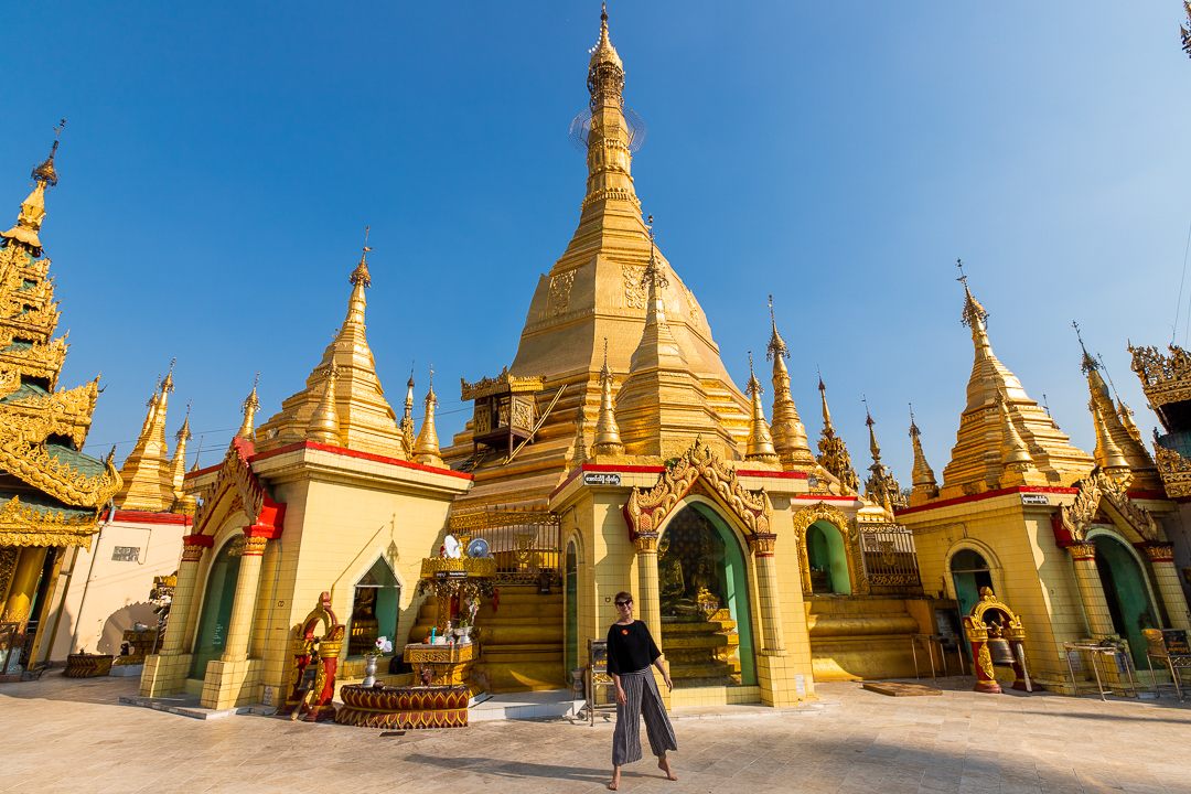 Woman with Golden Pagoda Yangon Myanmar